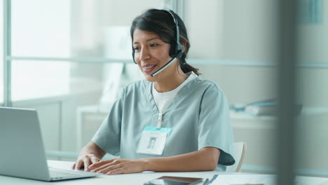 Hispanic-Female-Doctor-Talking-on-Online-Video-Call-on-Laptop